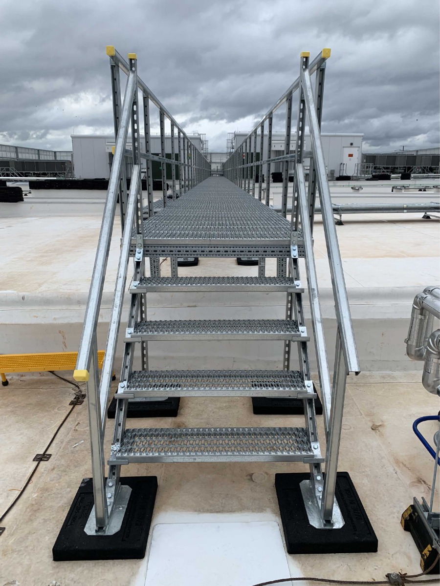 Custom Rooftop Crossover Stairs designed with non penetrating roof mount rubber bases