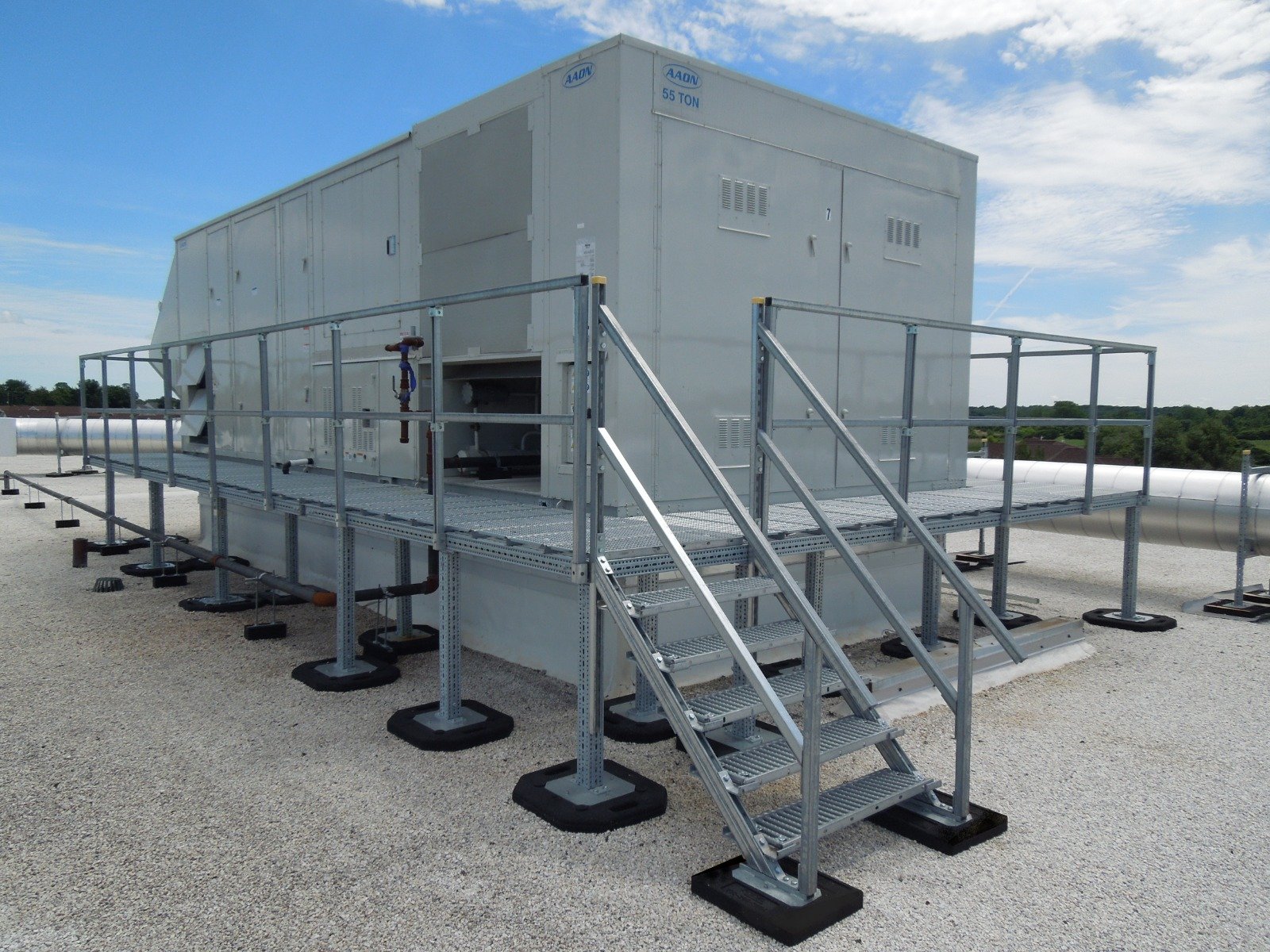 Rooftop platforms are custom designed around your rooftop equipment and supported by non penetrating roof mount rubber bases